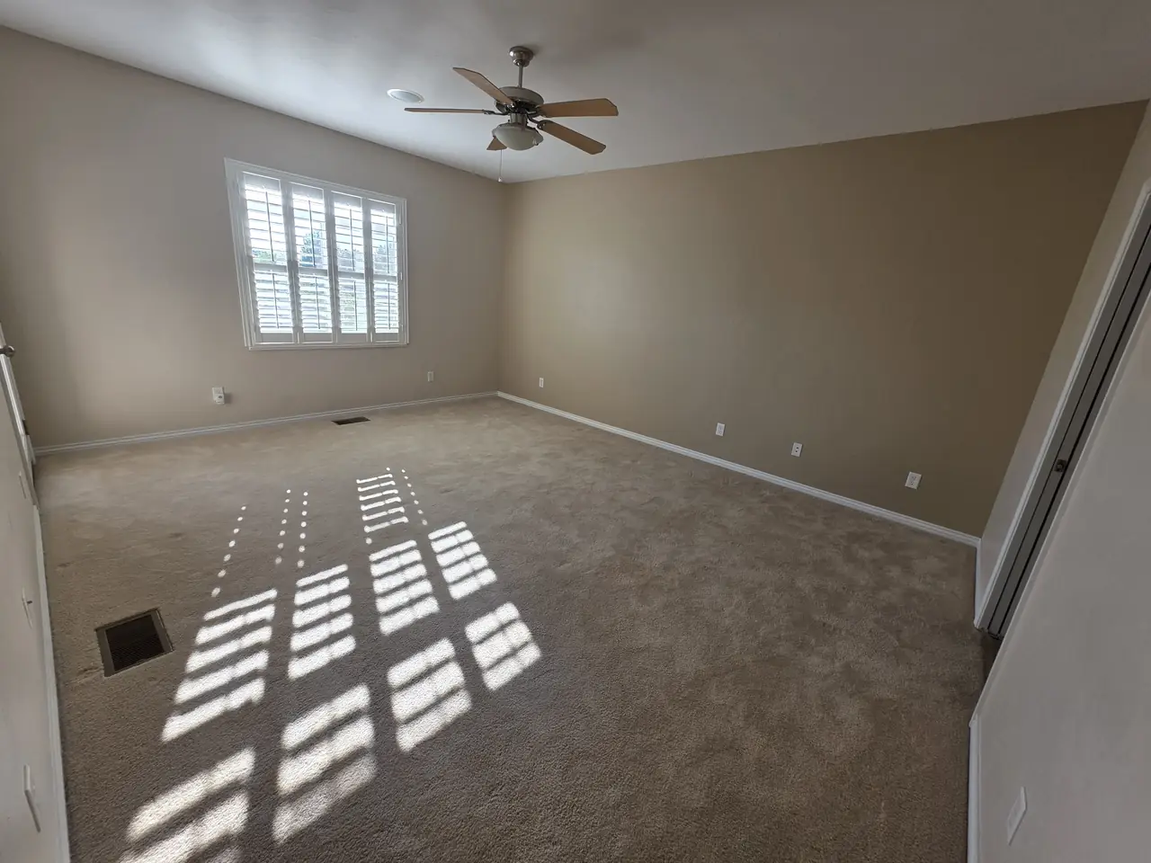 Freshly painted bedroom with plantation shutters