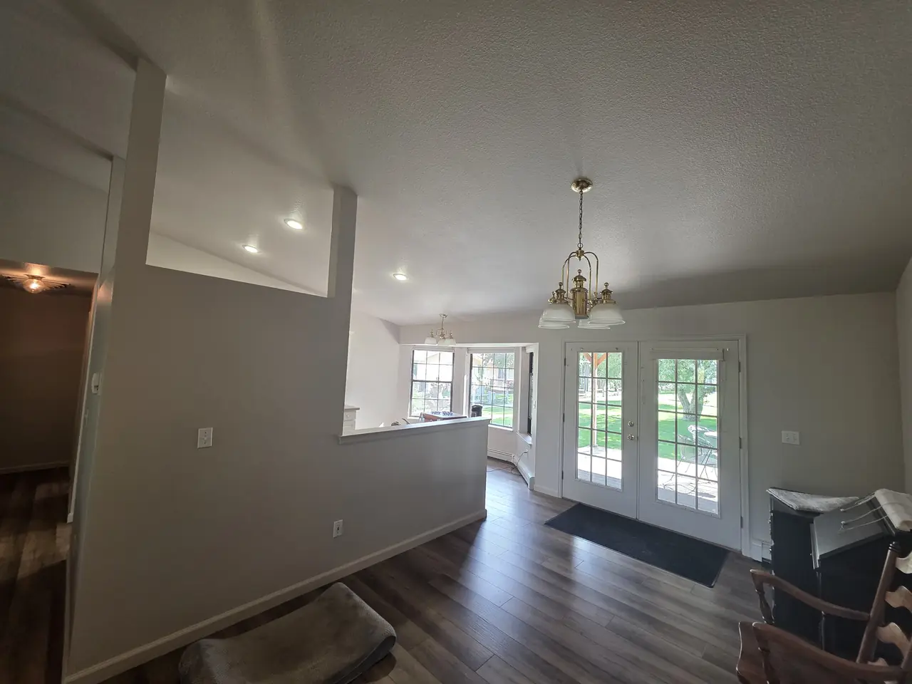Open living area with fresh paint and French doors